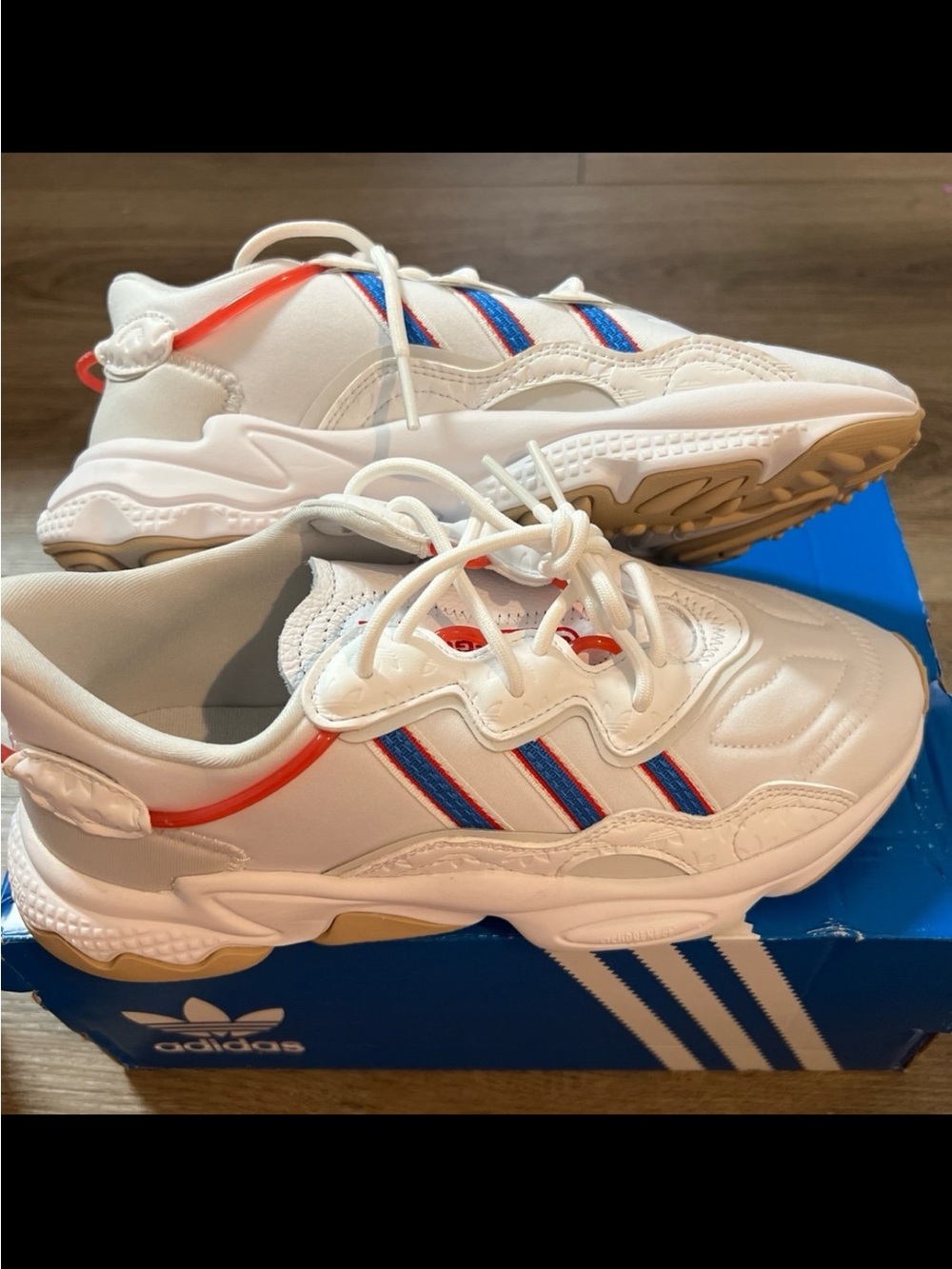 adidas Woman’s White Sneakers with Blue & Red Stripe Accents